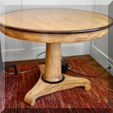 F06. Round wooden pedestal table. 30”h x 42”w 